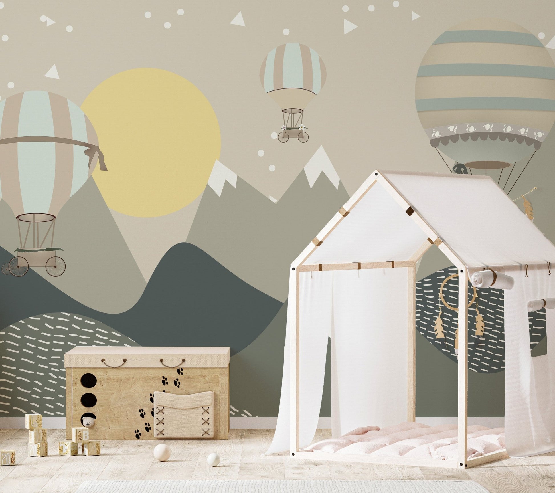 Nursery wall mural featuring alpine mountains and a large yellow moon pattern.
