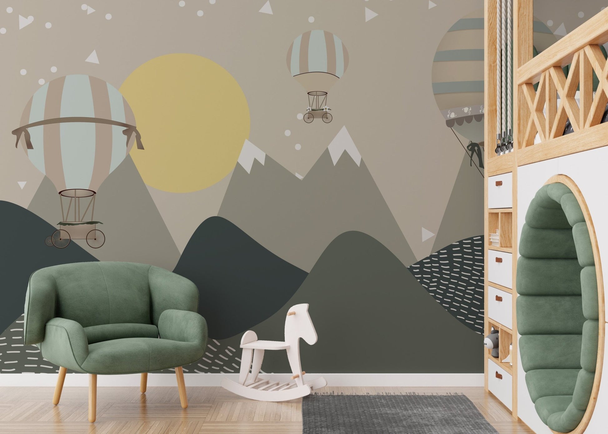 Green armchair placed against a grey mountain and balloon wall mural.