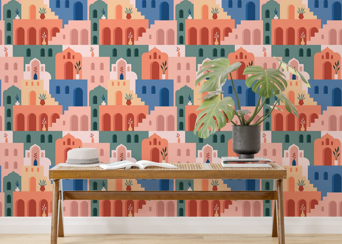 Living room feature wall using Moroccan Oriental Streets wallpaper and plants.