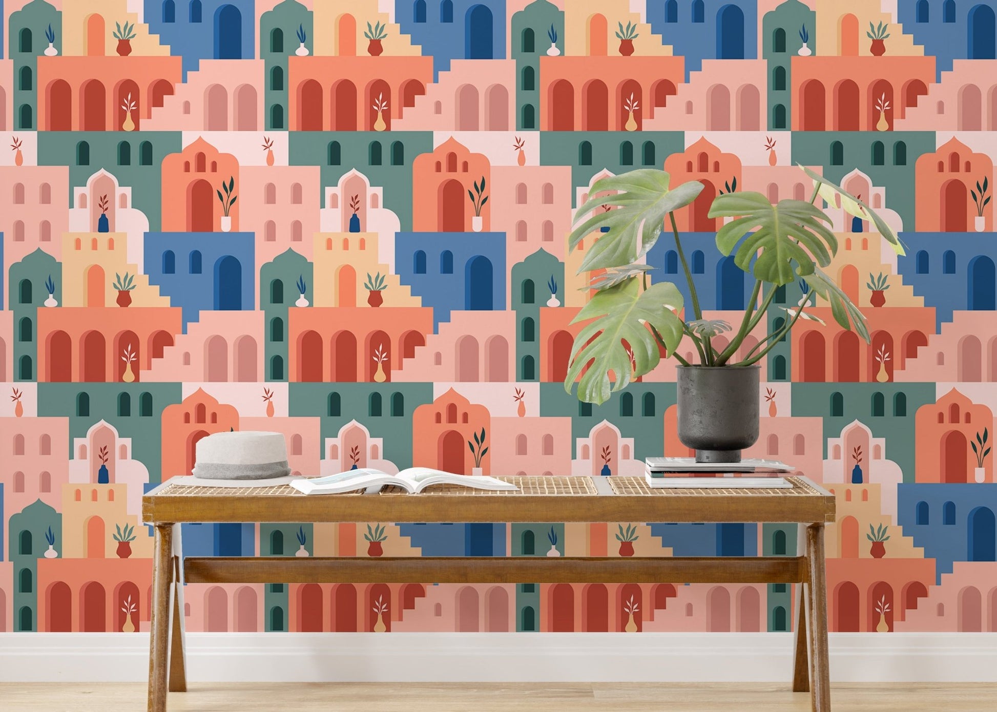 Living room feature wall using Moroccan Oriental Streets wallpaper and plants.