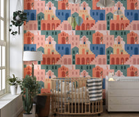Bohemian wallpaper with terracotta and blue houses in a minimalist nursery.