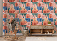 Colorful building wallpaper paired with a wooden rocking chair and basket.