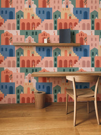 Moroccan Oriental Streets wallpaper decorating a wall with a wooden study desk.
