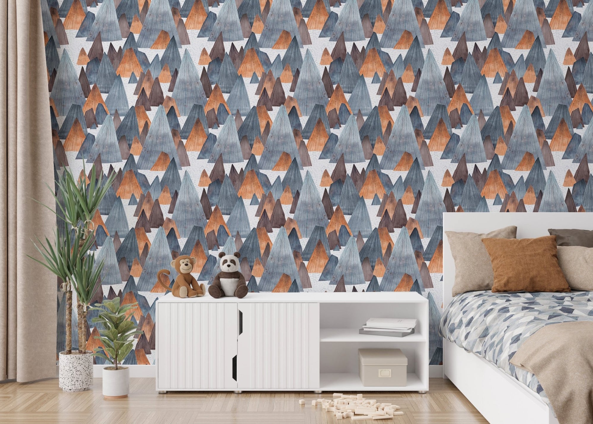 Mountain landscape adventure wallpaper in kids bedroom with white furniture.