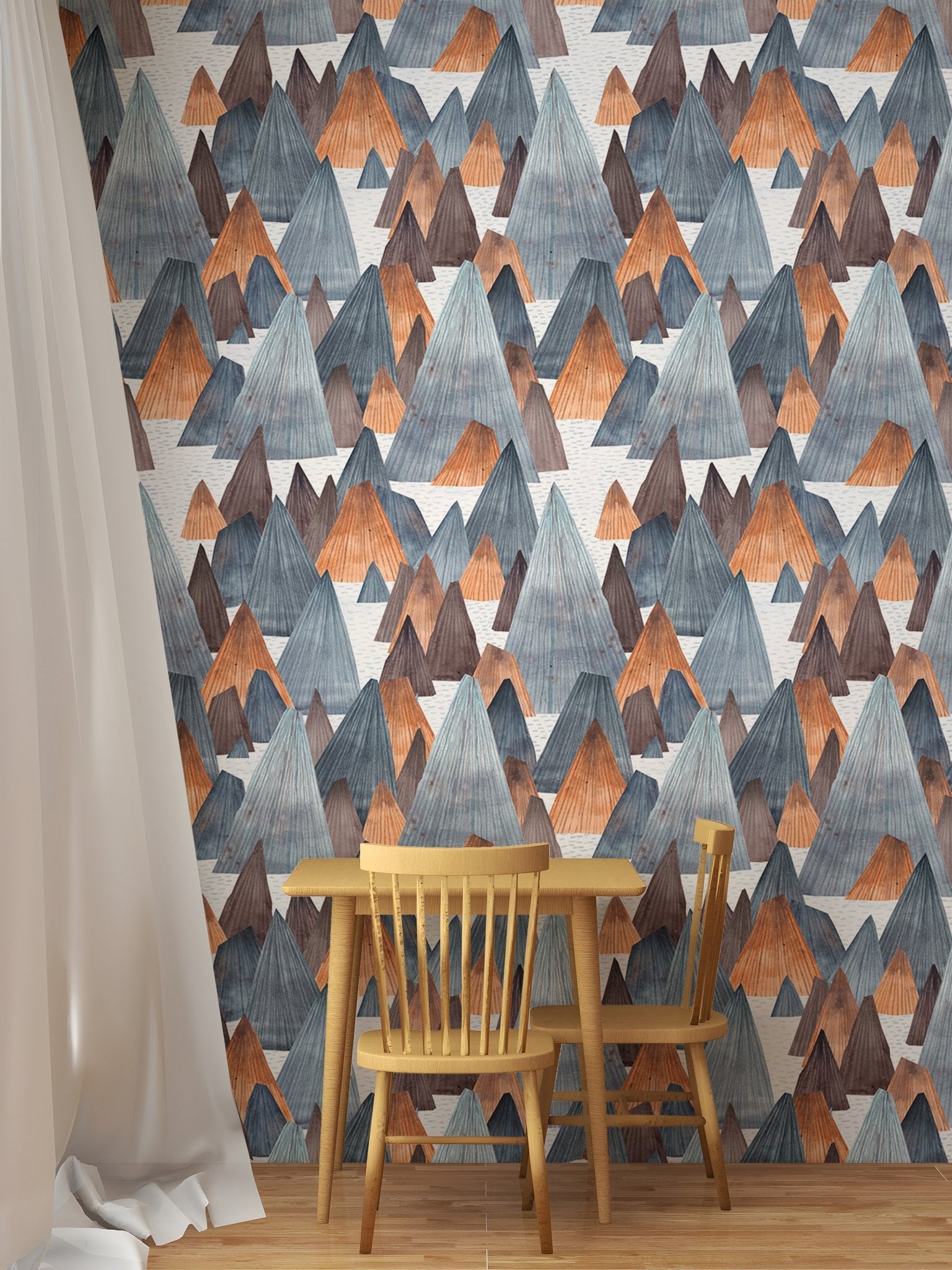Geometric mountain landscape wallpaper in dining area with wooden table.