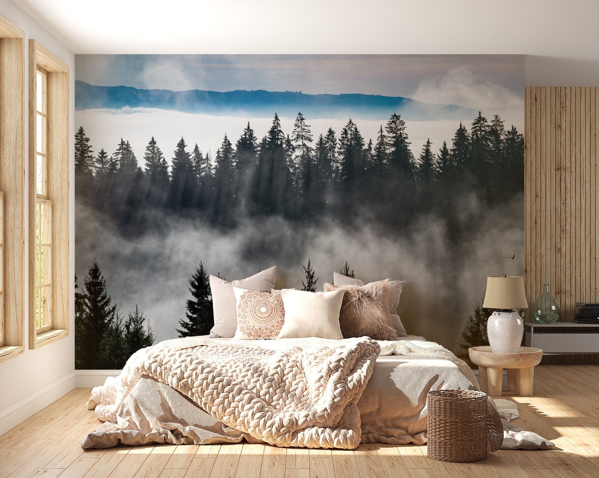 Cozy bedroom setup with wooden floors and misty pine forest wall mural.