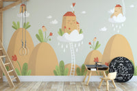 Children's study area wall mural featuring orange mountains and a wooden ladder.