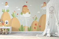 Playroom earthy tone wall mural with a white desk and decorative dreamcatcher.