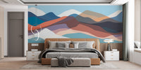 Abstract mountain wall mural featuring hues of blue, orange and beige