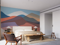 Artistic abstract mountain mural with layered colors and soft gradients.