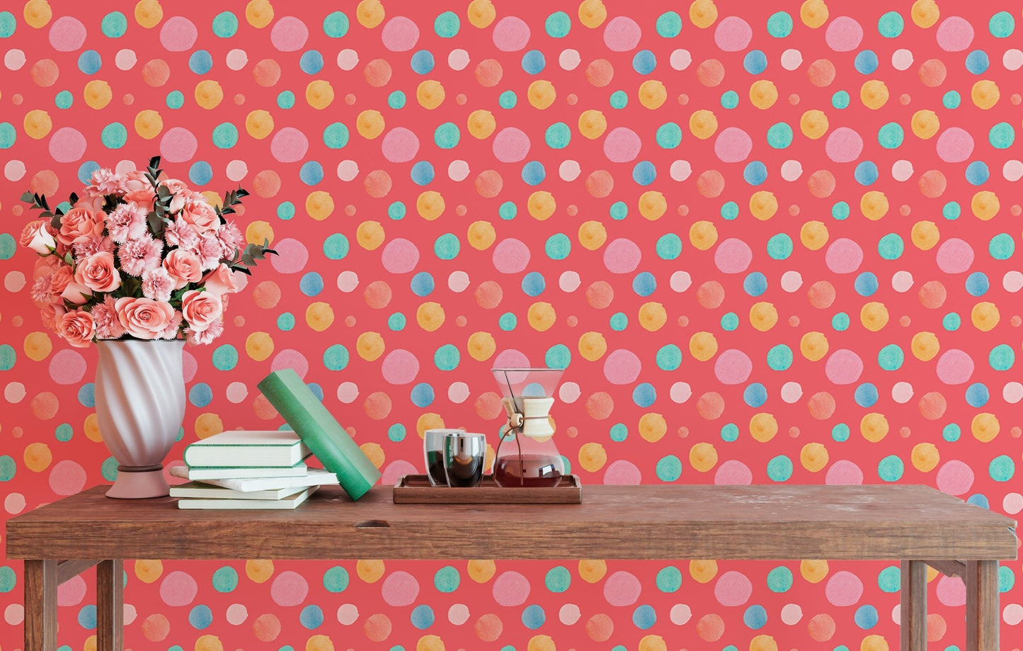 Abstract circle wallpaper mural behind a desk with pink flowers and books.