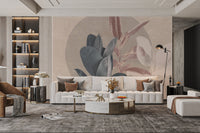 Abstract botanical wall mural for living room with muted pastel leaf prints.