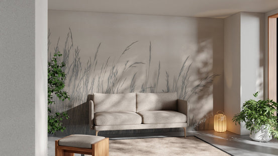 Grey grass landscape wall mural in a minimalist living room with a beige sofa.