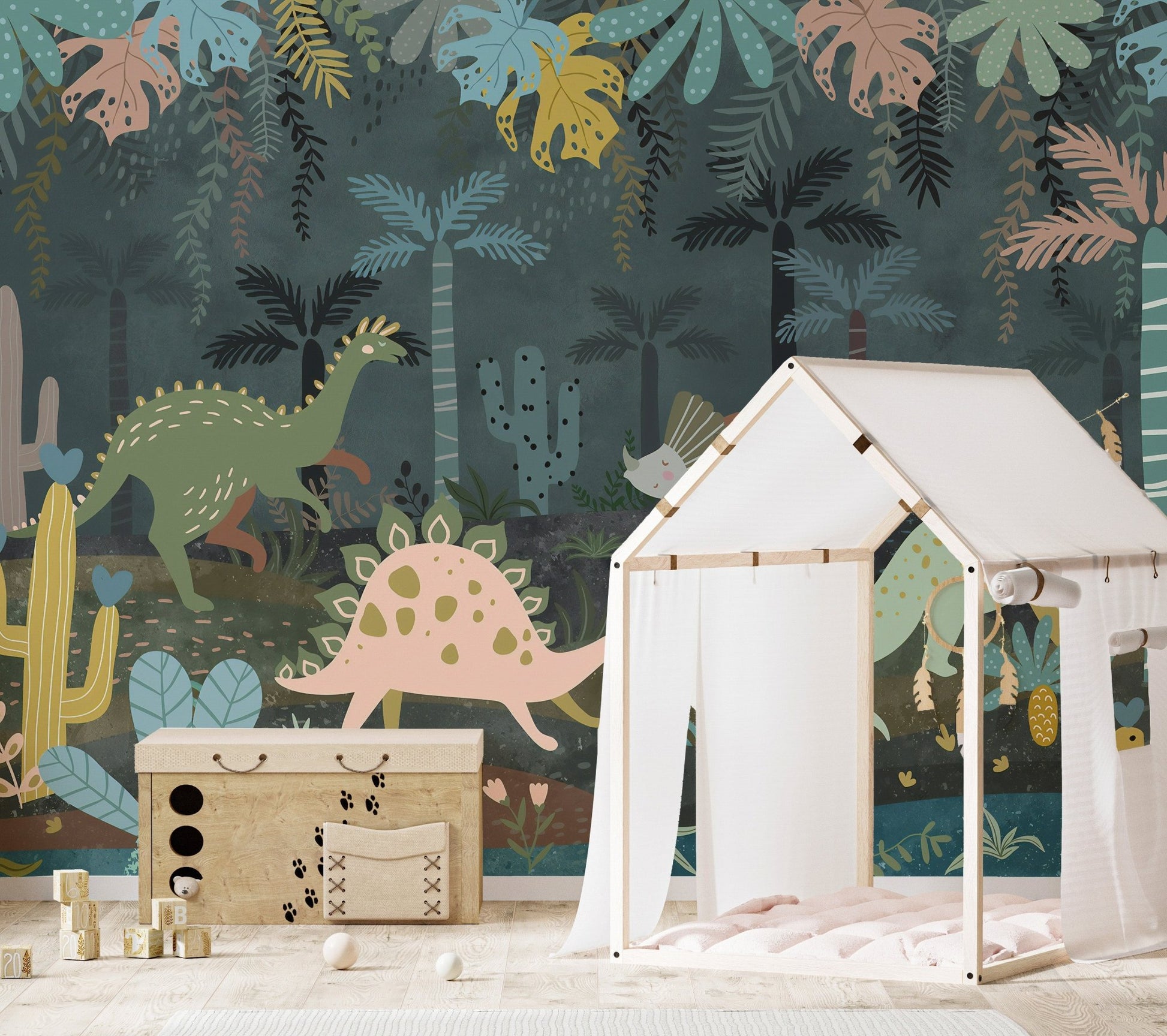 Play area featuring a dark green dinosaur wall mural with a white toy tent.