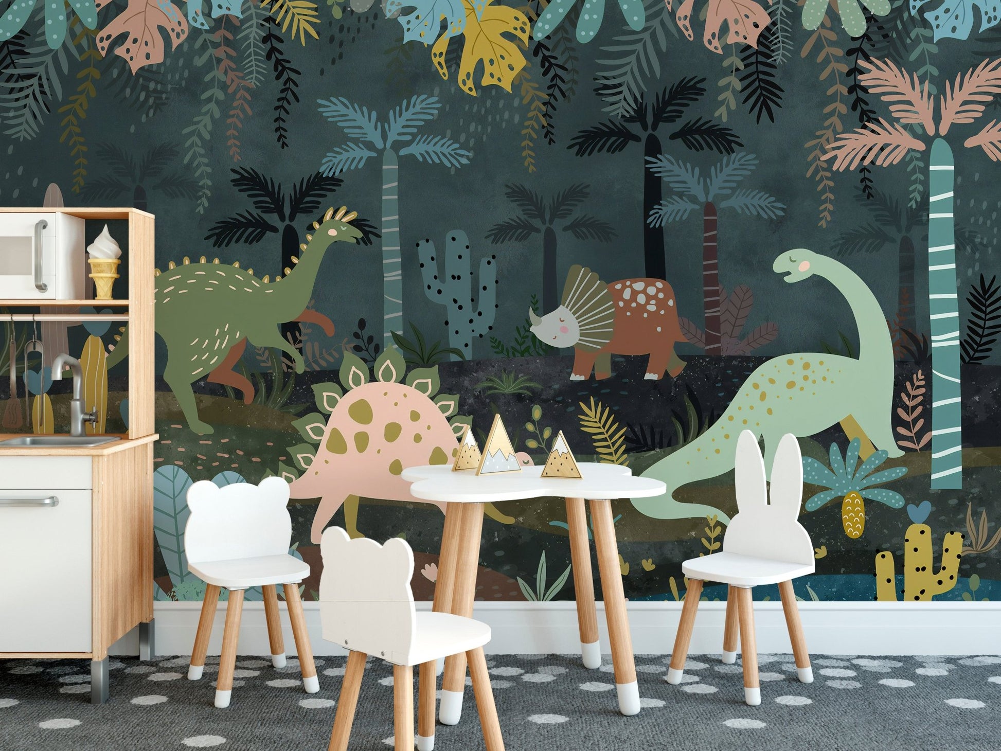 Small white table and chairs against a dark mystical prehistoric wall mural.
