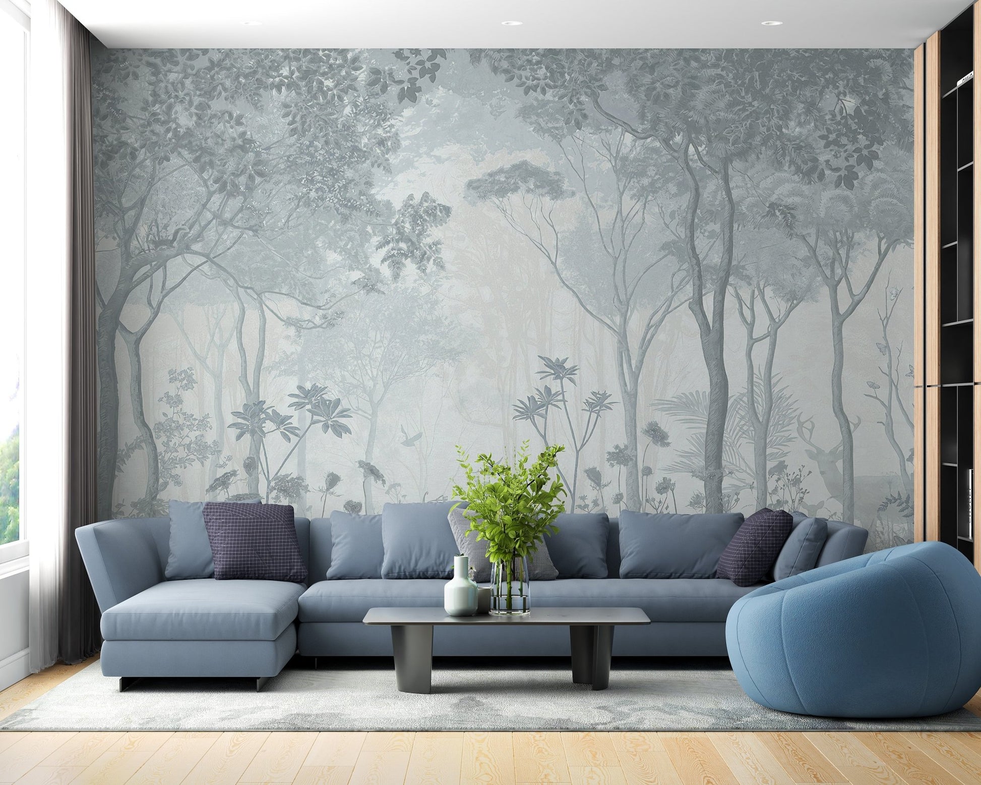 Tranquil fog forest wall mural behind a blue sofa in a modern flat.