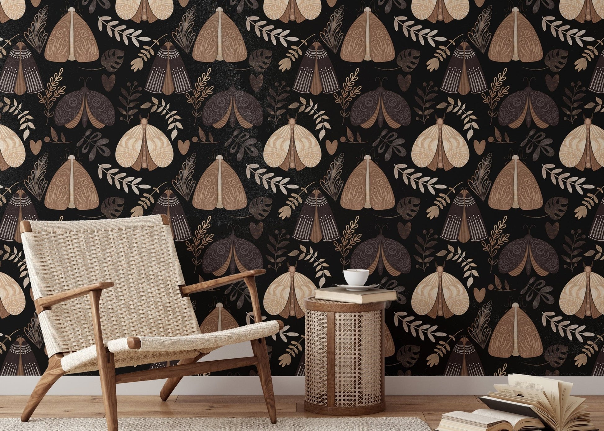 Dark floral wallpaper with insect motifs behind a wooden armchair and table in reading area.