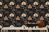 Symmetrical moth wallpaper on a dining room wall with white table and vases.