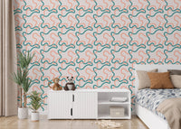 Naive Boho Green and Orange Lines Wallpaper in a bedroom with wooden furniture.