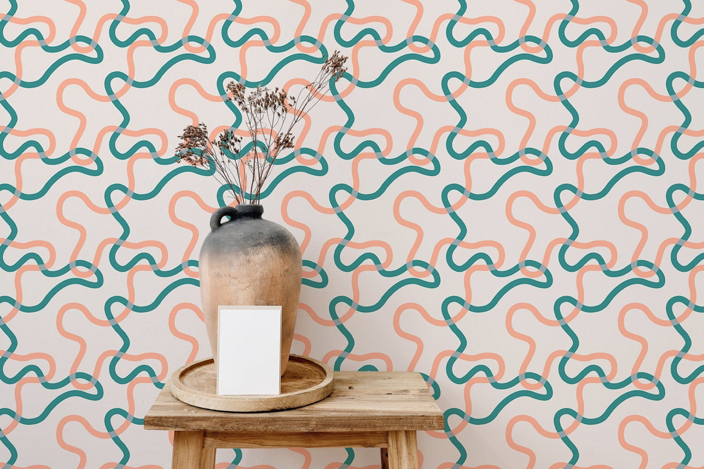 Modern living room featuring a patterned wallpaper with wavy interlocking lines.