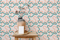 Modern living room featuring a patterned wallpaper with wavy interlocking lines.