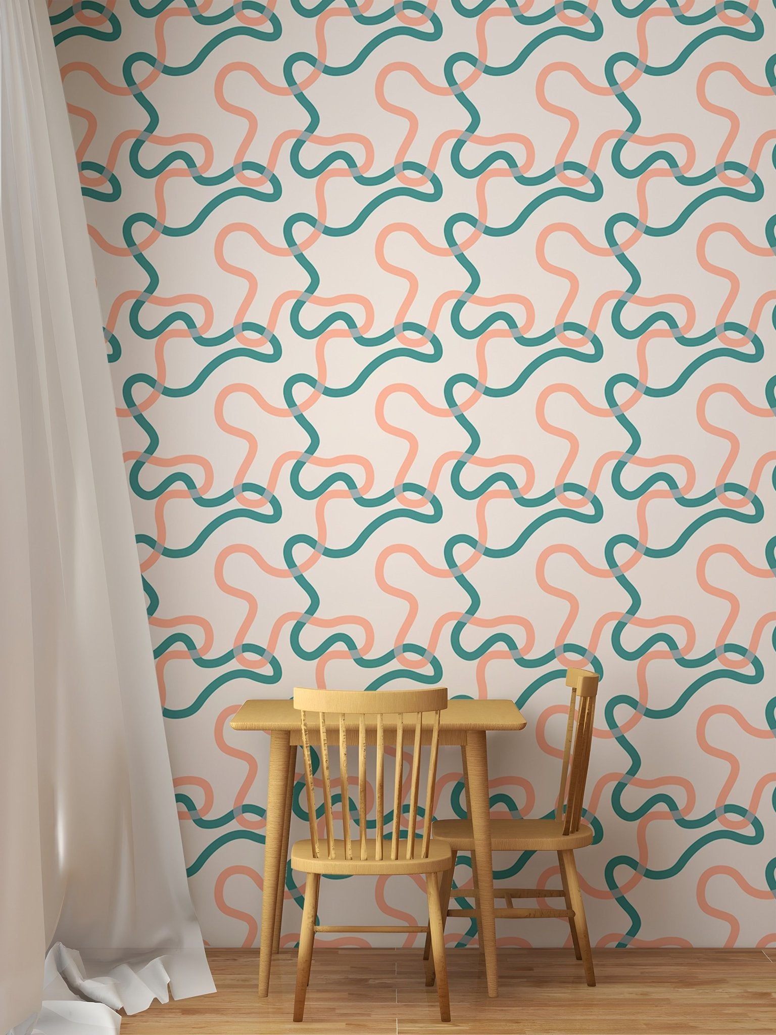 Teal and orange line art wallpaper in a dining area with wooden chairs and table.