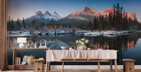 Long dining room with a large mountain landscape wall mural.