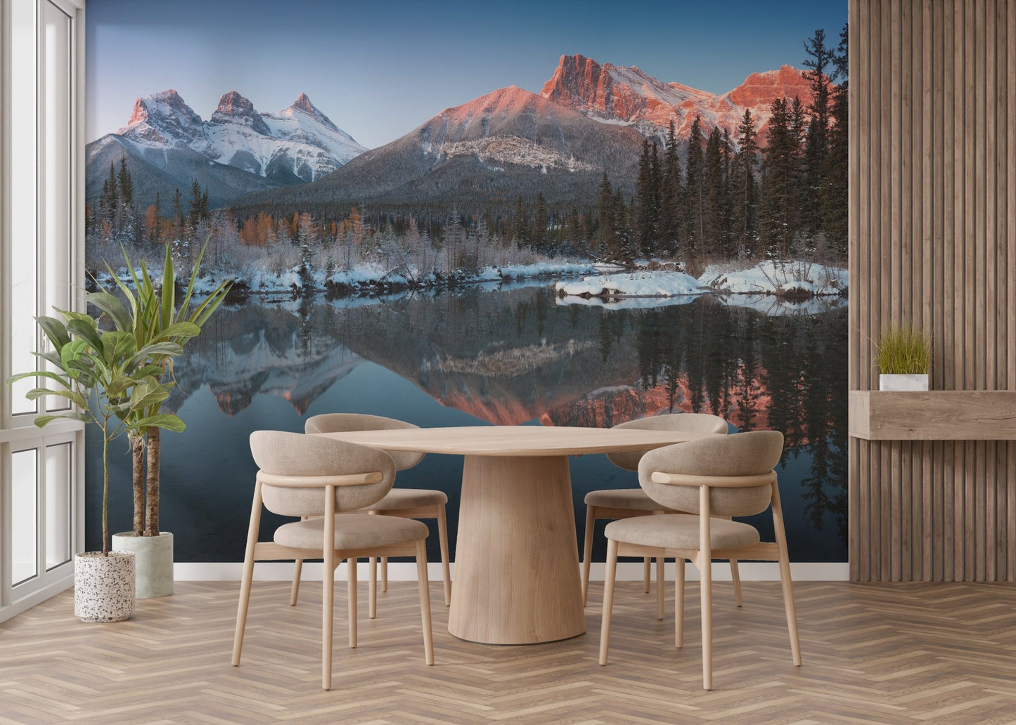 Dining area with a blue and grey mountain wall mural.