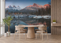 Dining area with a blue and grey mountain wall mural.