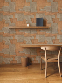 Modern workspace with orange stone wallpaper and a wooden desk with chair