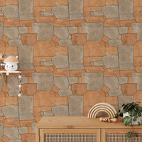 Stone pavement wallpaper behind a light wood cabinet and small plants