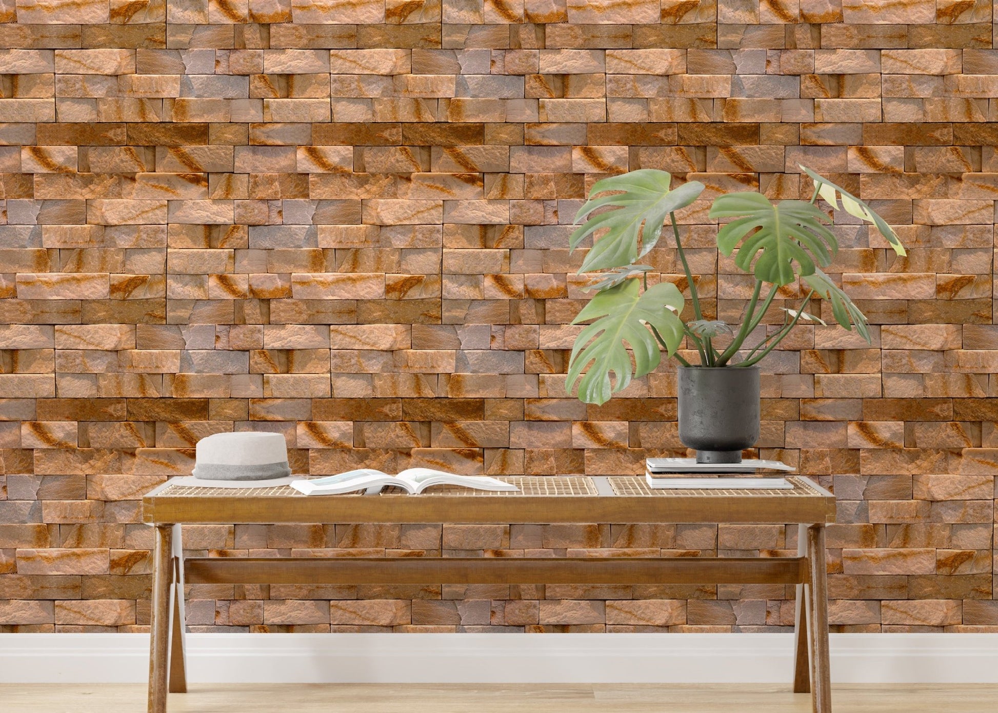 Modern living space featuring a stone wallpaper accent wall and green plants.