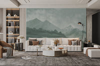 Forest green misty mountain wall mural used in a spacious living area.