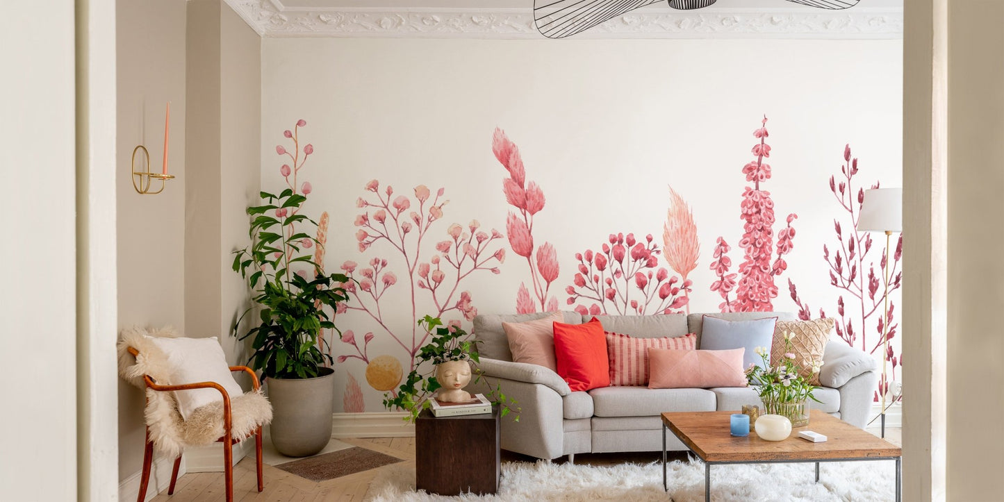 Dried flower wall mural used as a backdrop for a grey sofa in a living room.