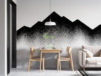 Abstract dotted landscape wall mural in a dining area with wooden furniture.