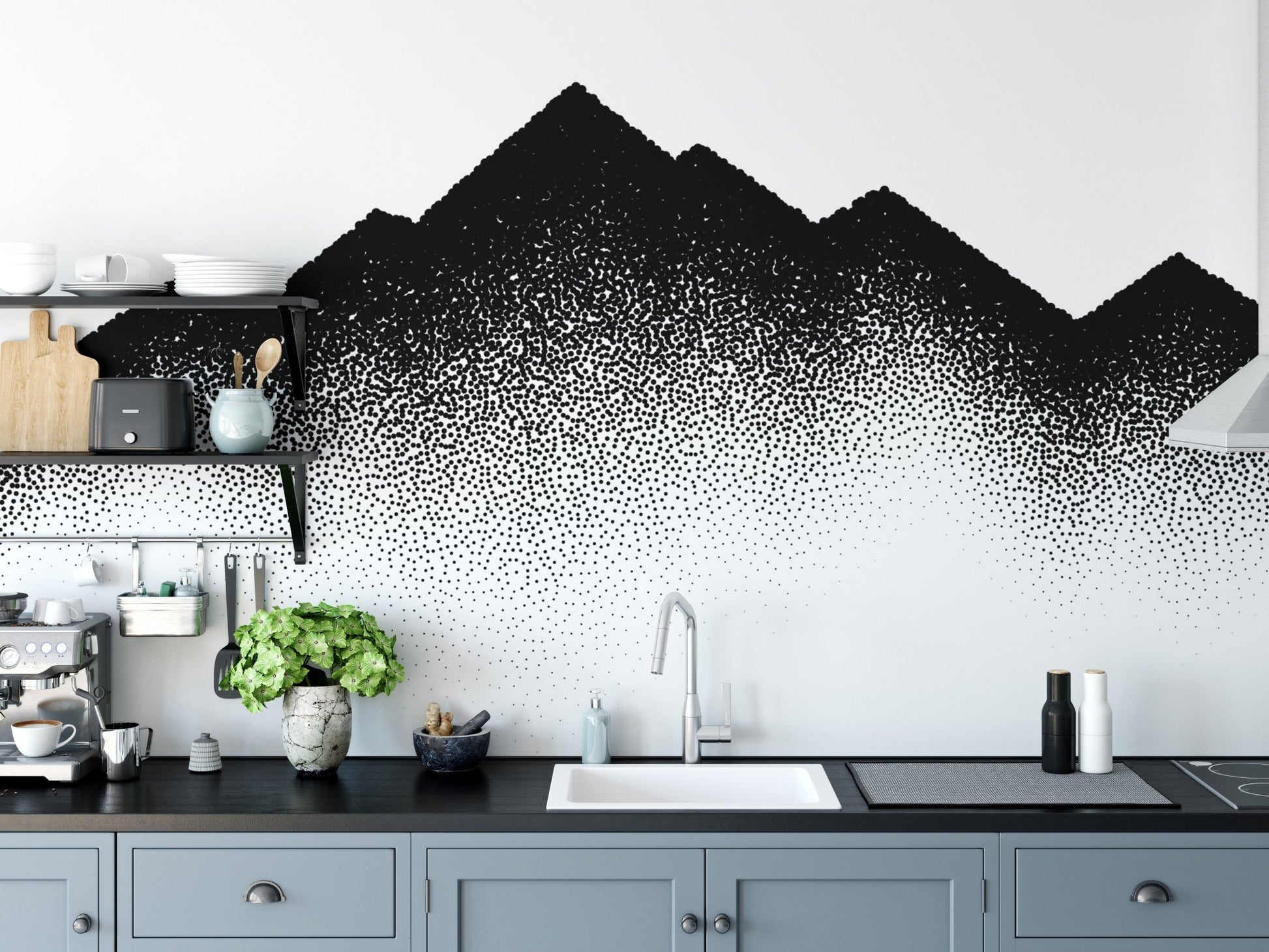 Dotted peak mural design on a kitchen backsplash wall with grey cabinets.