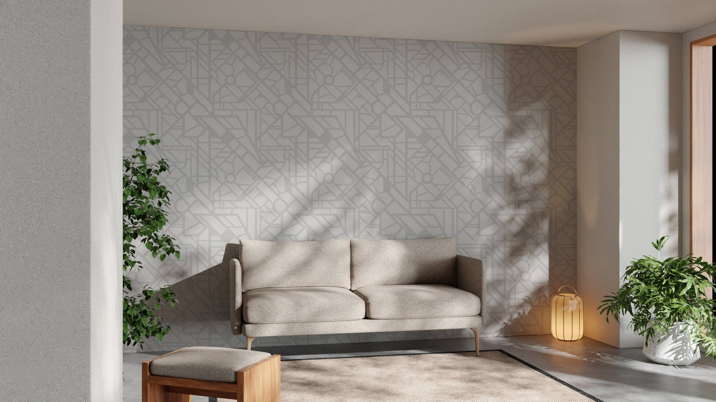 Neutral tone cityscape wallpaper in a living area with a tan leather couch.