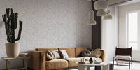 Navigating the Cityscape Wallpaper in a living room with a brown sofa and cactus.


