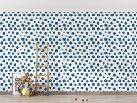 Navy Blue Indigo Watercolor Polka Dots Wallpaper in a playroom with a wooden ladder.