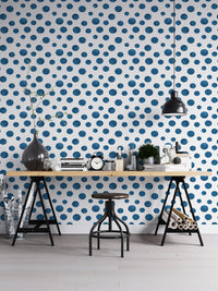 Navy Blue Indigo Watercolor Polka Dots Wallpaper in a home office with a wooden desk.