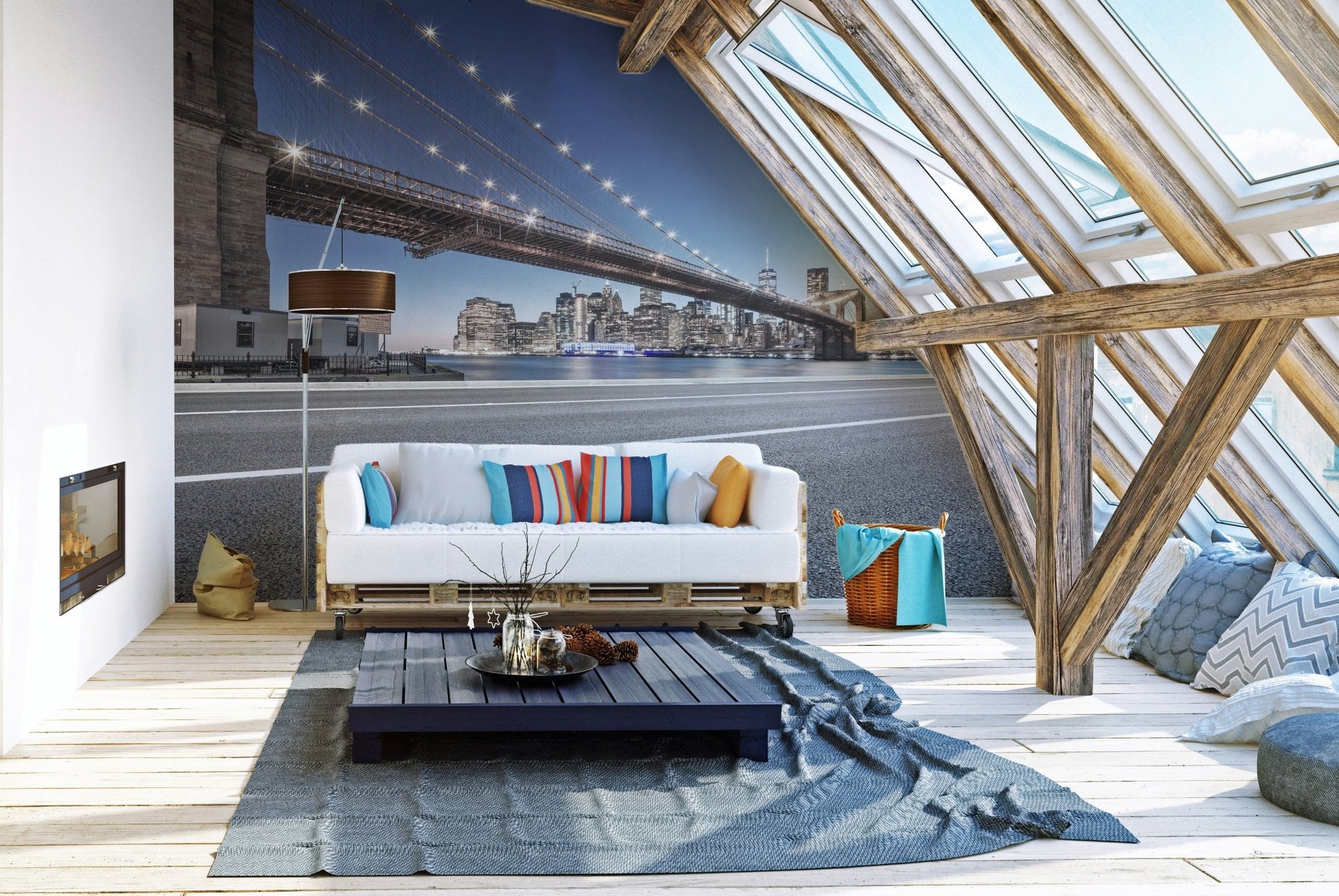 New York bridge wall mural behind a white sofa in a bright attic living room.