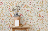 Small flower pattern wallpaper used as a backdrop for a ceramic vase on a table