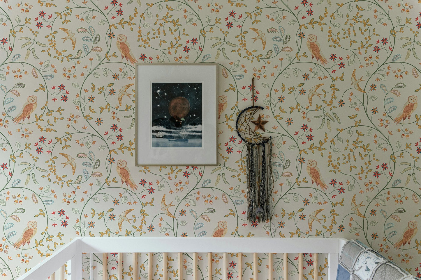 Newill Peppermint Russet Flower Wallpaper in a nursery above a white wooden crib