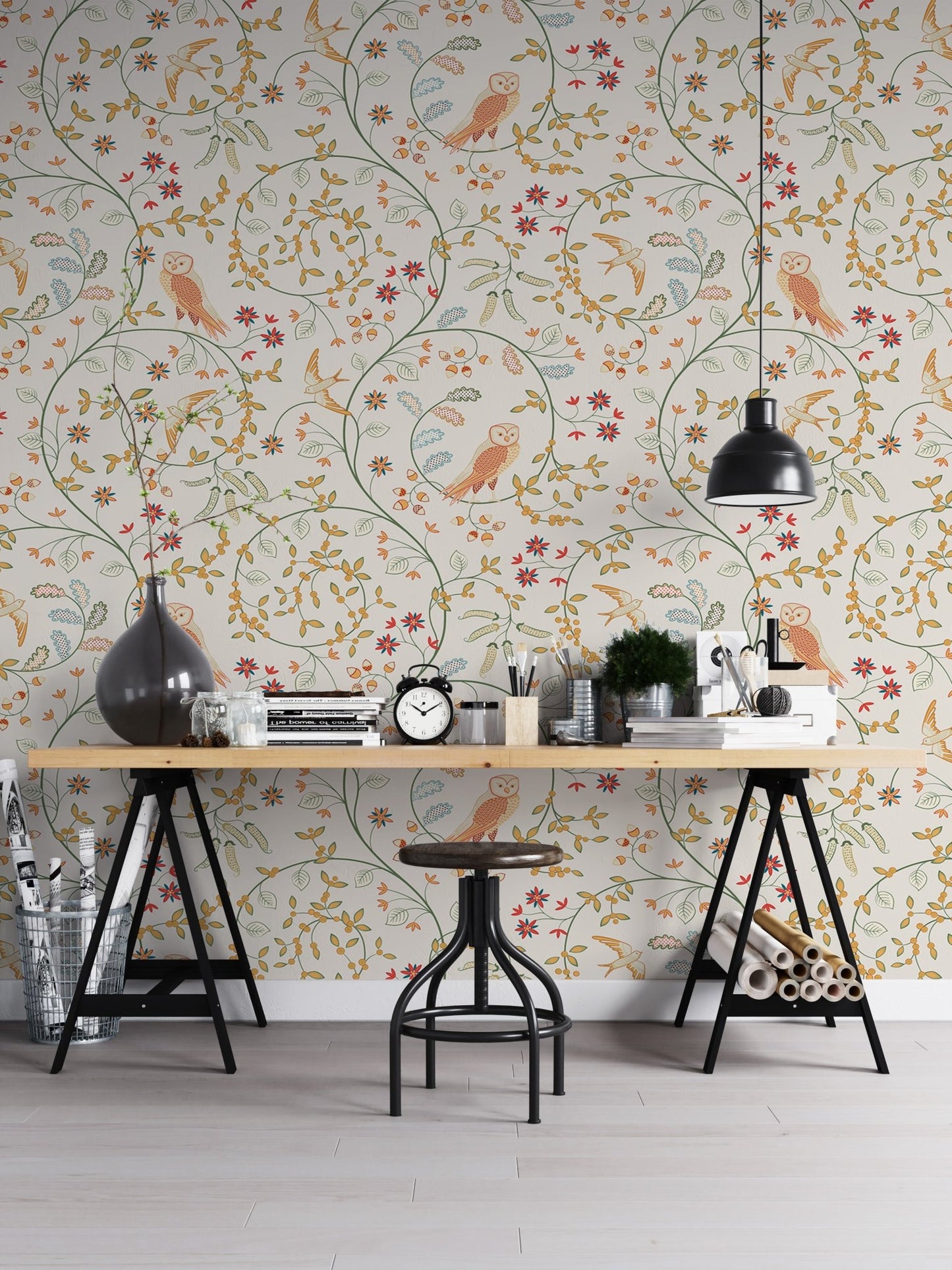 Classic flower wallpaper behind a large studio desk with metal stools