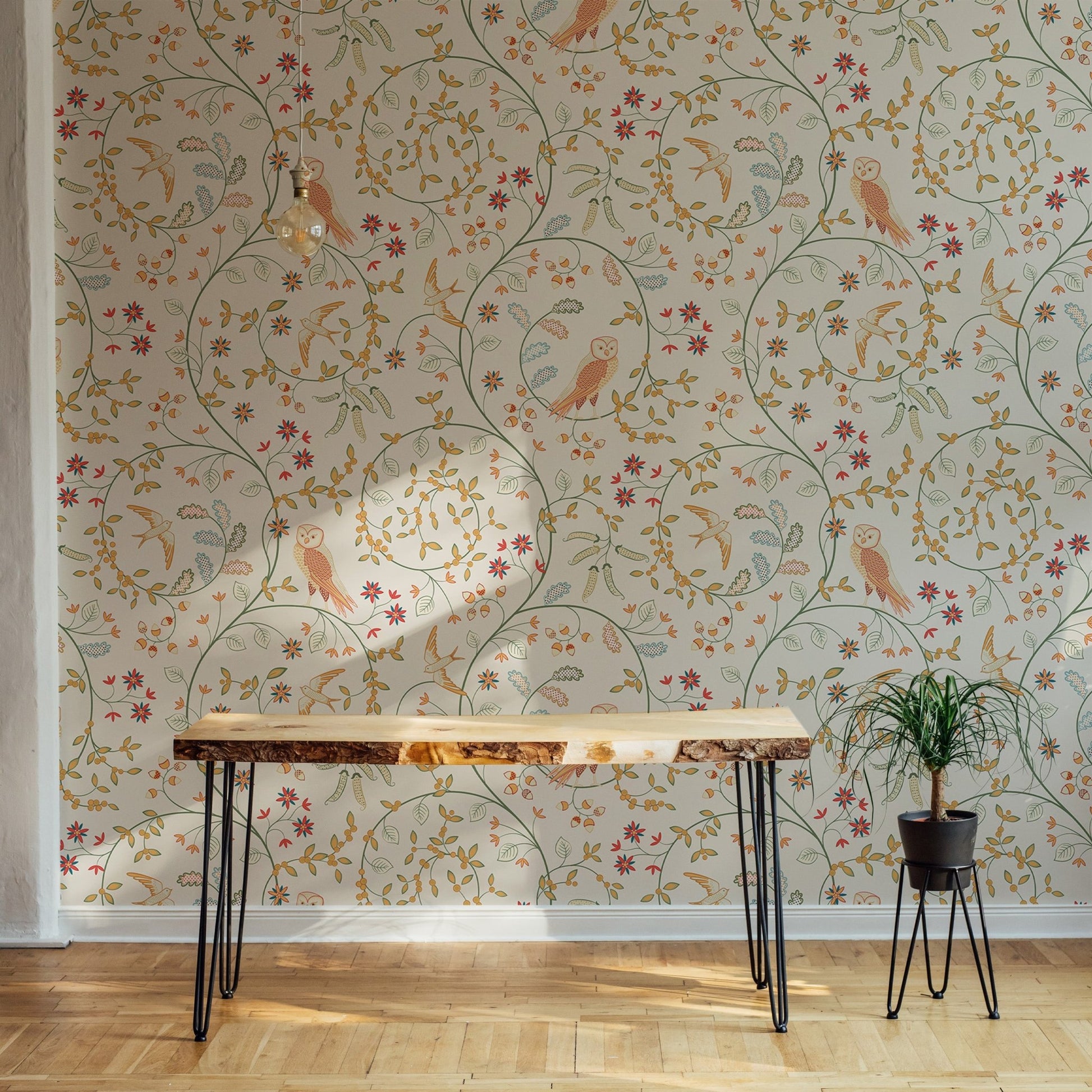 Newill Peppermint Russet Flower Wallpaper behind a wooden console table in a hallway