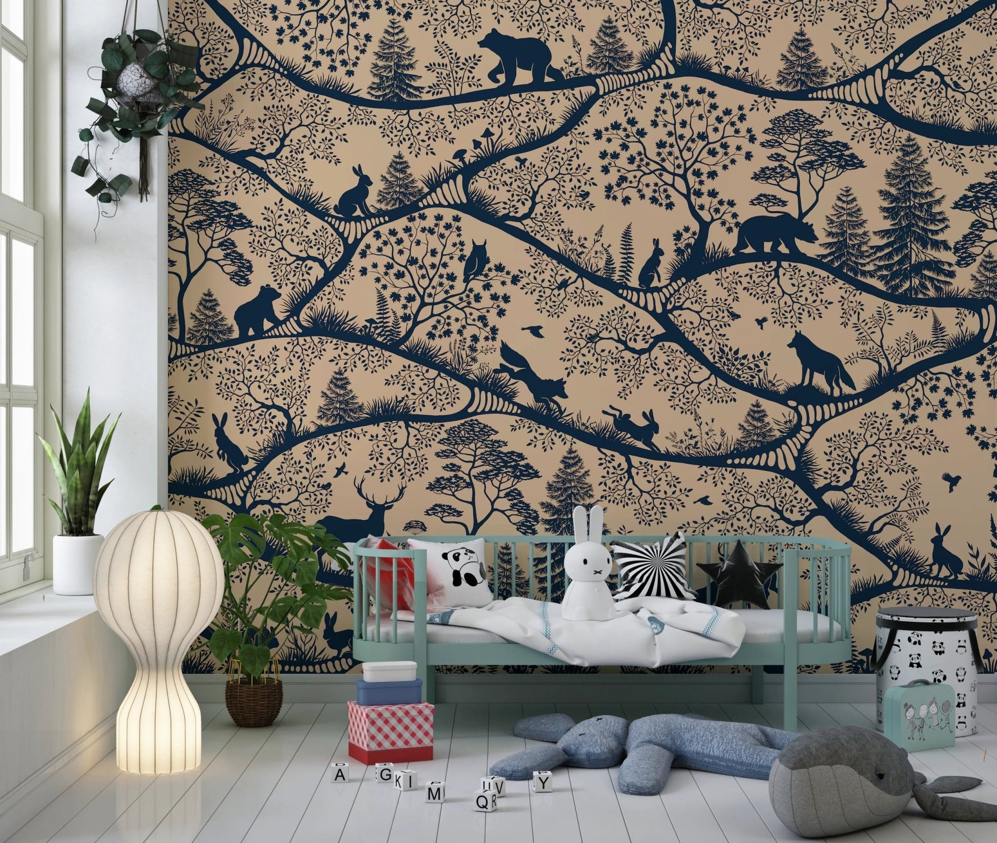 Nordic animal pattern wall mural used as a feature wall in a nursery with a light wood crib.