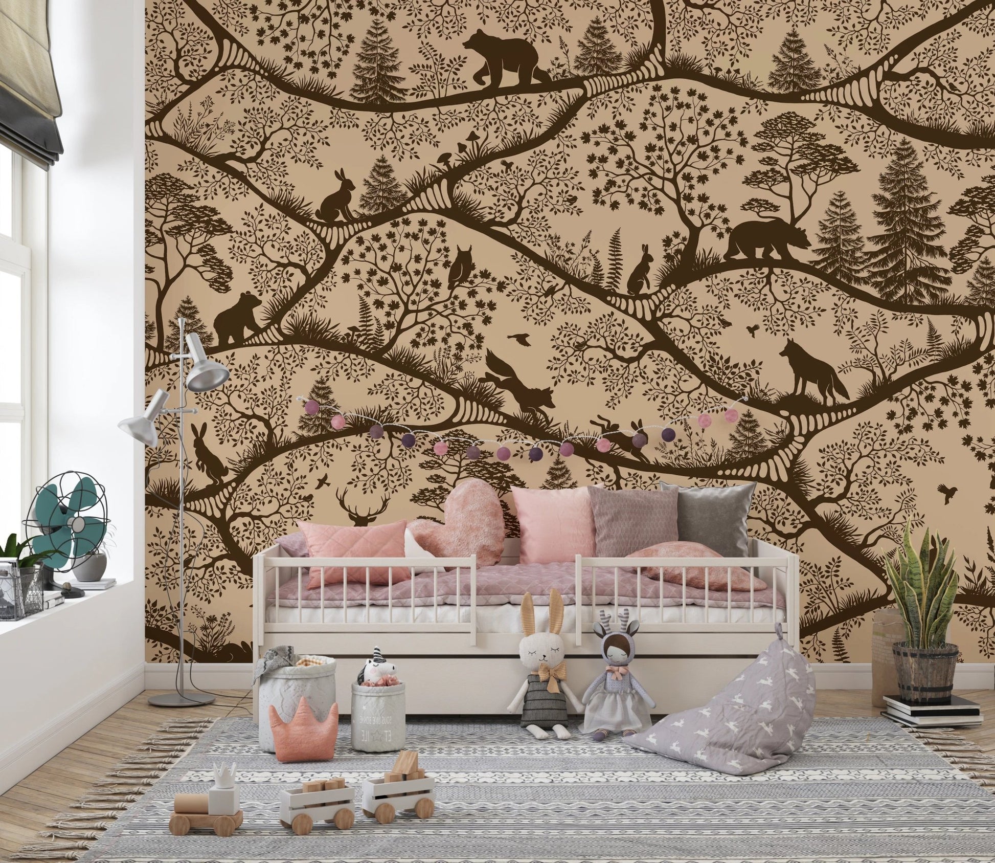 Brown woodland wall mural in a child's bedroom with pink bedding and a white bed.