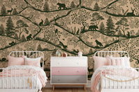 Twin beds with pink bedding set against a beige and green forest wall mural