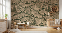Small desk and chair for kids placed in front of a beige forest wall mural.