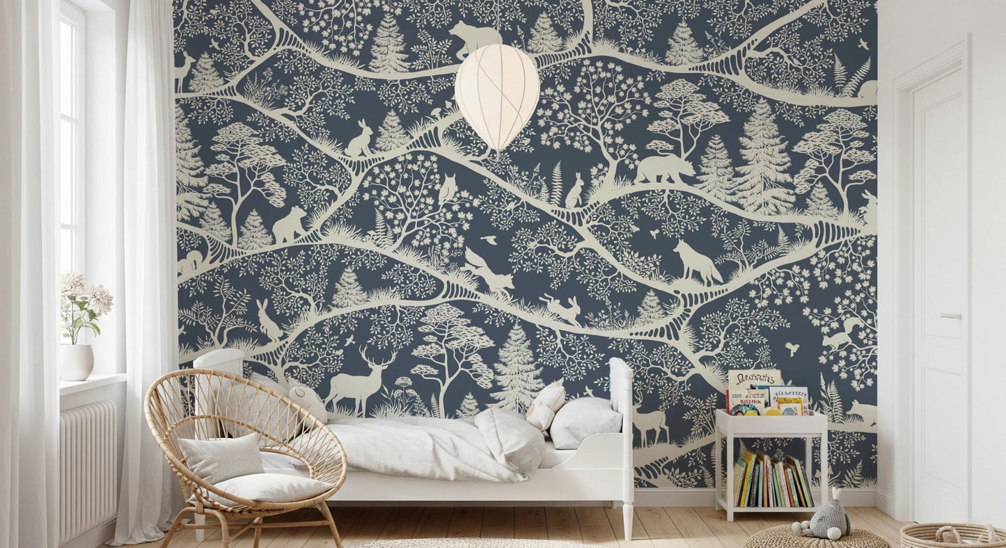 Toddler bedroom featuring a blue forest wall mural and a small white bed.